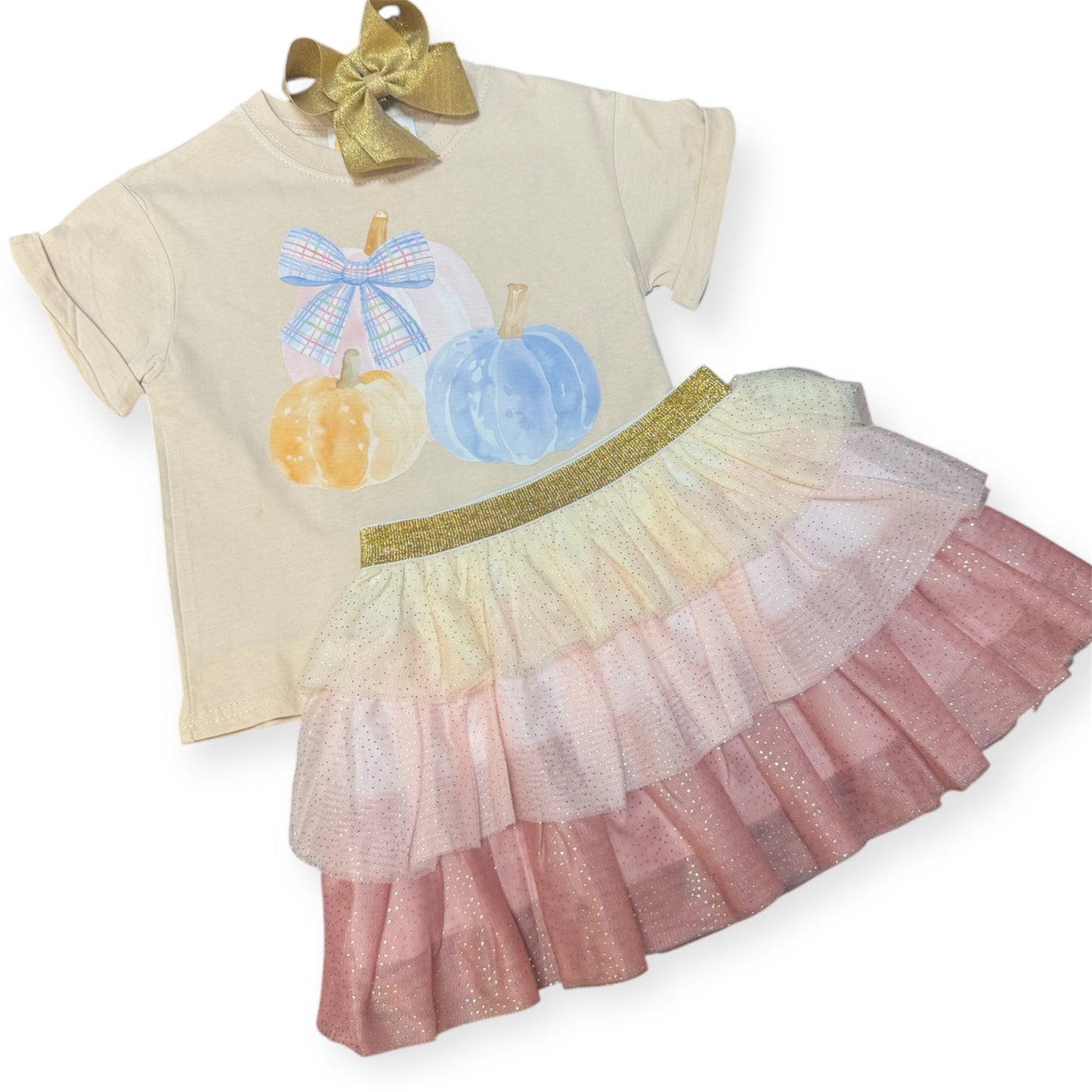 Three pumpkins on tan