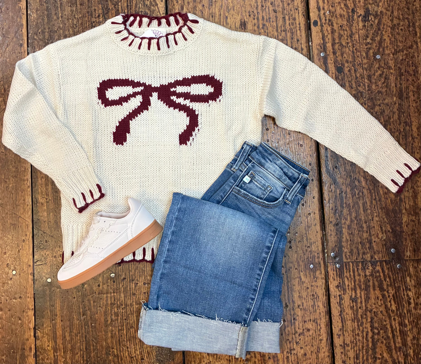 Blanket stitch crew neck sweater with bow