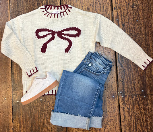 Blanket stitch crew neck sweater with bow