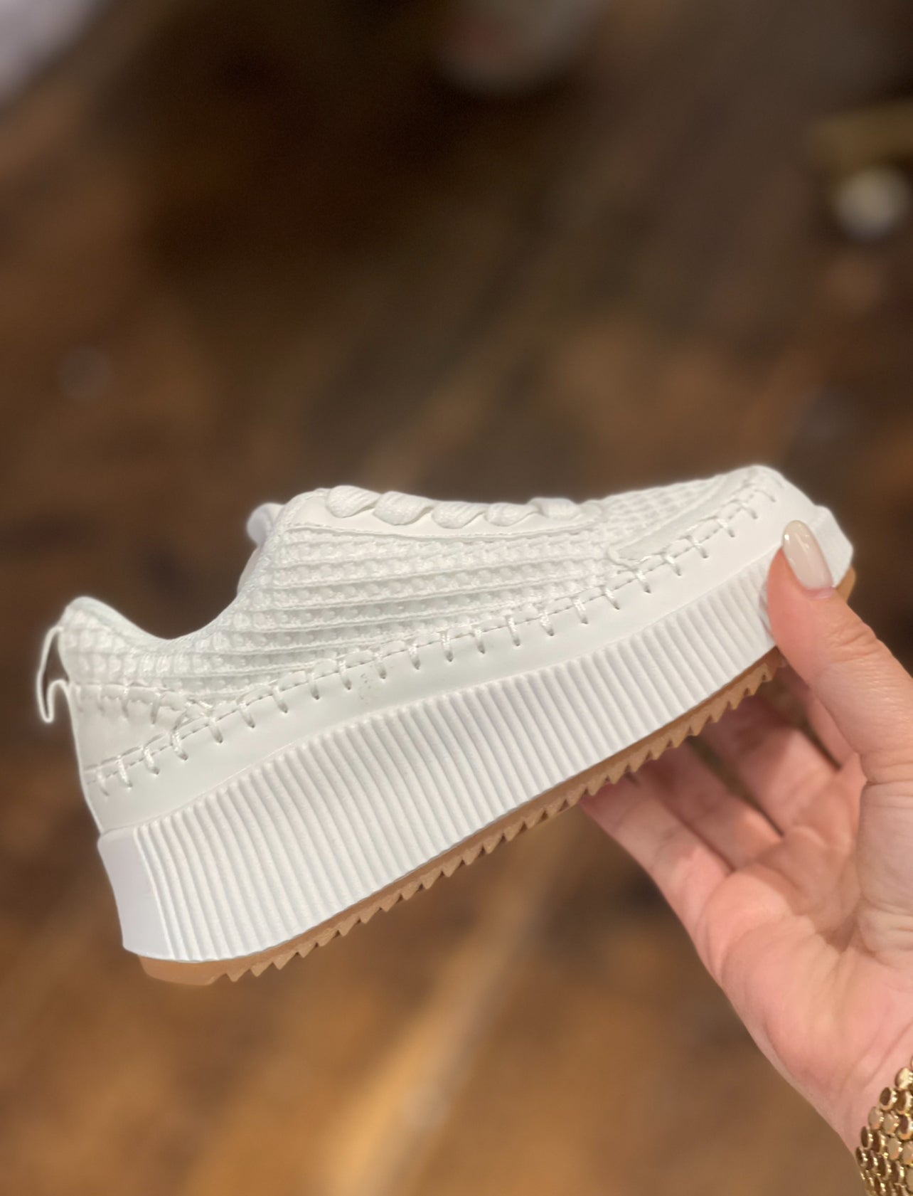 White mesh tennis shoe