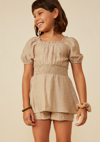 Girls Smocked Waist Textured Skirted Romper in Beige